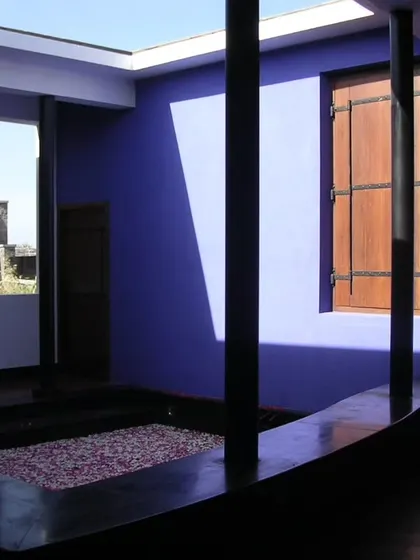 A small, sky-lit courtyard painted in a vibrant indigo blue creates a surprising and joyful moment within the Synergy factory. These courtyards are essential to our design, bringing light, air, and color deep into the building's interior.