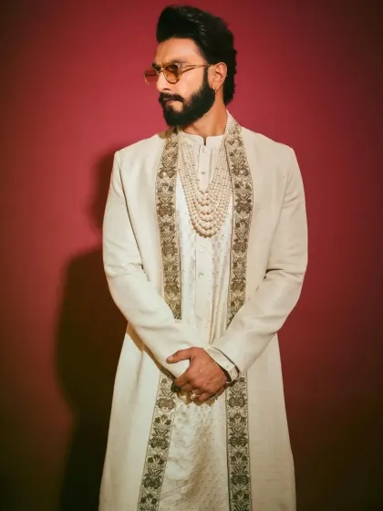 A close-up portrait highlighting the styling and accessories that complete this celebrity look.