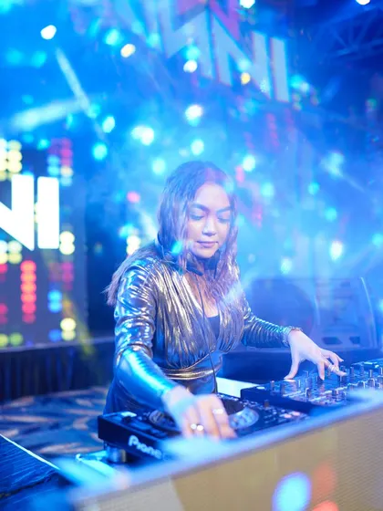 Surrounded by blue smoke and lights, I'm completely focused on the mix.