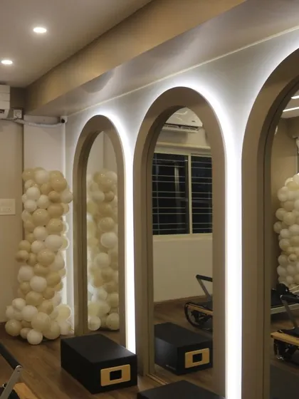 The beautiful arched mirrors that line our studio wall, helping you check your form and adding to the aesthetic of the space.