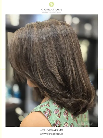 A side profile of our sun-kissed highlights, demonstrating the natural and effortless glow we aim for.