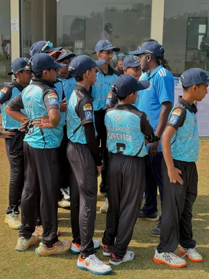 Giving last minute instructions to the U-14 team during the Disha Premier League. Strategy and planning are just as important as skill.