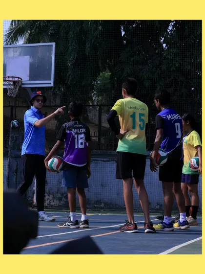 I take a moment to give specific instructions to our U-14 players. Clear communication and individual attention help them understand complex techniques.