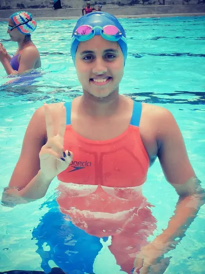 A moment of celebration in the pool. This swimmer shows the positive spirit and confidence we build at Dolphin Aquatics.