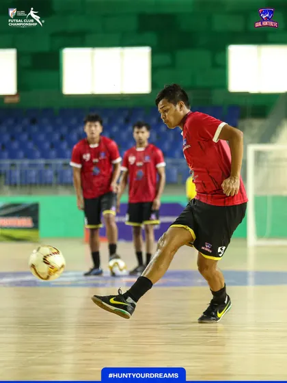 A player practicing his shooting accuracy before the semi-final.