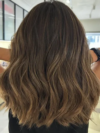 Summer beach blonde highlights on a one-length textured lob. I added invisible layers to create movement without sacrificing the clean line of the cut.