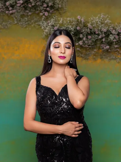 A close-up of a glamorous evening look. The focus is on the bold fuchsia lip and the clean, sharp winged eyeliner, creating a powerful and confident style.