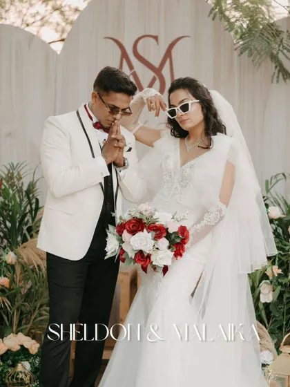 A cool and stylish wedding portrait with the couple in sunglasses. The custom monogram adds a personalized touch to this fun and modern shot.