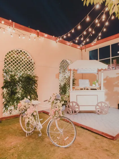 The magic is in the details that tell your story. For a Parisian-themed cocktail night, we created a charming Ladurée pop-up, complete with a floral bicycle, offering guests a sweet, unexpected escape.