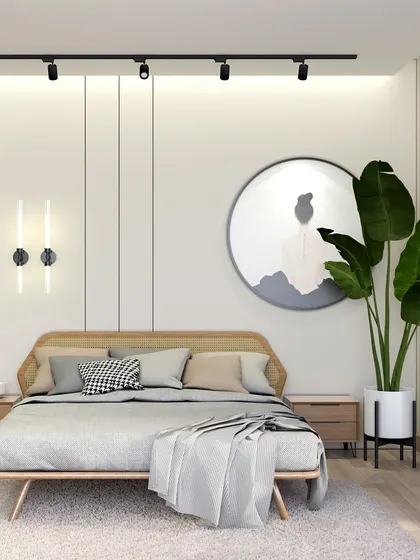 This view highlights the track lighting and simple, circular artwork, which complement the Scandinavian-inspired aesthetic. The overall design is meant to be a peaceful retreat from the busy city.