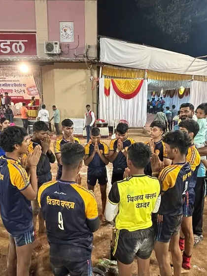 A moment of prayer and team unity before a crucial match.