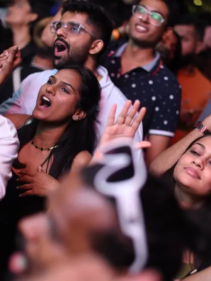 The crowd singing along to their favorite track. A moment of unity.