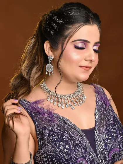 A close-up of the semi-cut crease eye makeup that pairs beautifully with our purple rental gown.