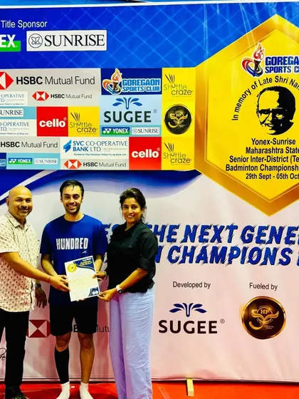 A men's semi-finalist receiving his award, acknowledging the intense competition and skill displayed on the court.