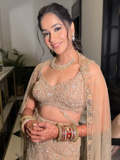 A portrait of Shrriya's reception elegance. The makeup is glamorous yet refined, allowing her natural beauty and the stunning outfit to shine.
