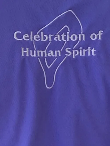 The "Celebration of Human Spirit" shirt worn at the Purple Academy launch perfectly captures the essence of this initiative.