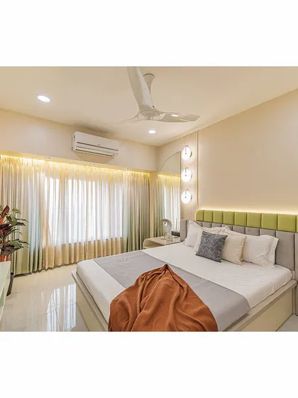 This view showcases the full length of the room, from the bed to the window. The design is clean and uncluttered, maximizing the sense of space and light.
