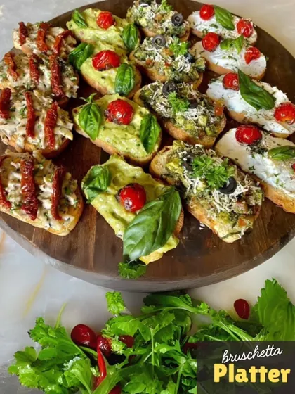 A close-up of our colorful Bruschetta Platter. We offer a variety of toppings on toasted bread, including classic tomato and basil, creamy avocado, and savory mushroom, making for a perfect party appetizer.