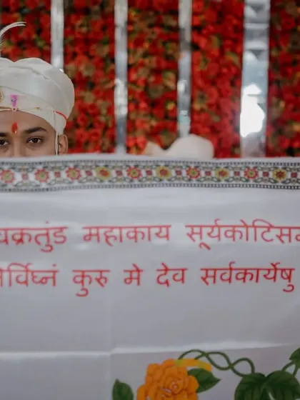 An artistic shot of the groom during the 'antarpat' ritual, where a cloth separates the couple before they see each other.