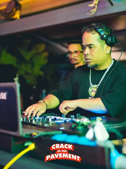 Locked in at the 'Crack in the Pavement' event. A focused shot of me on the turntables, deep in the mix.