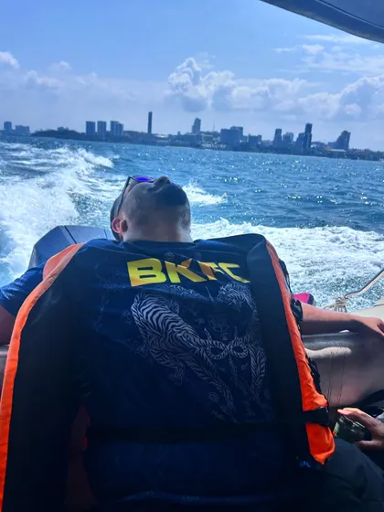 Taking a moment to relax and enjoy the view in Thailand. These trips are intense, so it's important to find moments of calm between the hard training sessions.