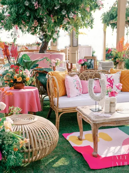 A vibrant lounge area at 'Villa Brissa'. The neutral tones of the rattan furniture provided the perfect backdrop for the vibrant, quirky prints characteristic of Balinese culture.