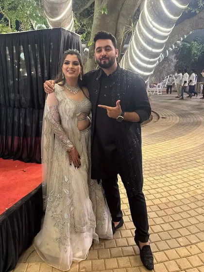 With a beautifully dressed guest at a wedding reception. I'm always there to celebrate the final performance and enjoy the party with the family.