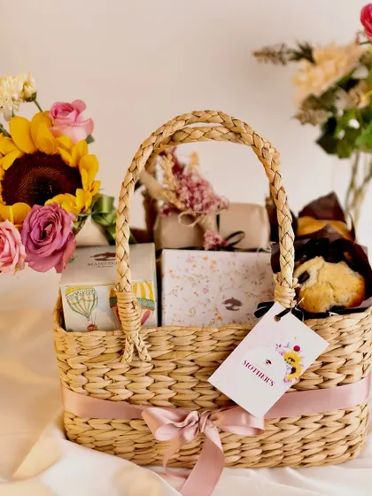 My Mother’s Day Basket is designed to make her feel cherished. It features a beautiful cone bouquet, blueberry muffins, lavender bon bons, assorted cookies, and a special jewelry box.
