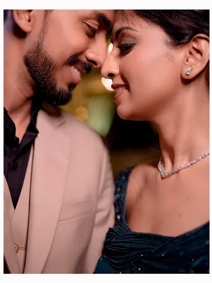 An intimate close-up focusing on the couple's happy expressions during their Sangeet.