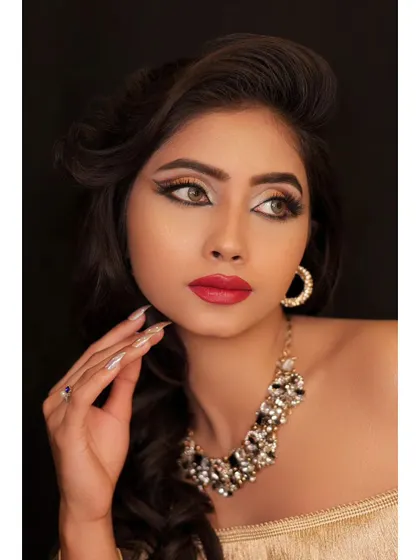 A beauty shot focusing on the model's flawless skin and elegant pose. The lighting is soft and flattering.