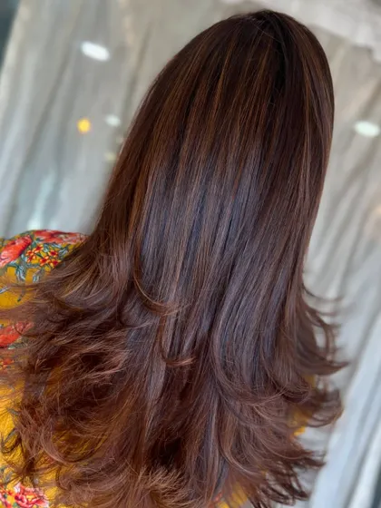 It's the season of caramel. This look features beautiful highlights on a layered cut, perfect for indulging in some hair sweetness.