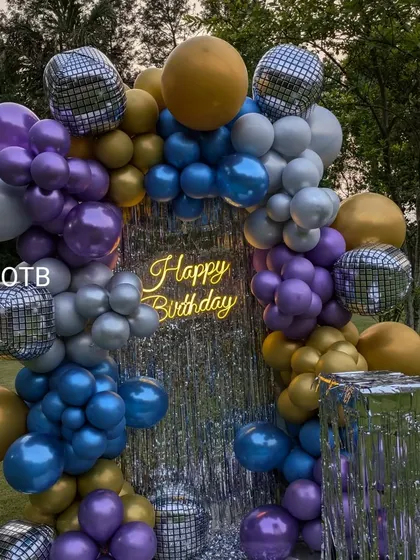 A detailed shot of the colorful balloons and disco ball accents that make this theme so much fun.