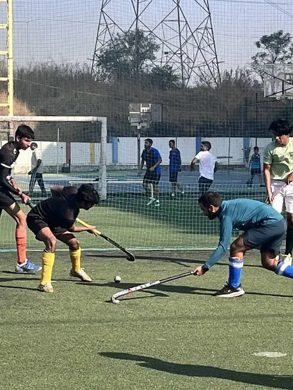 A close-up of a tackle during a practice game. This shot highlights the skill and precision required to play hockey at a competitive level.
