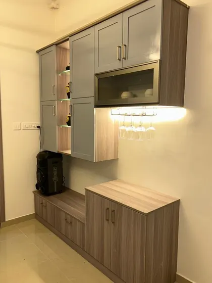 Another view of the crockery-cum-bar unit, highlighting its ample storage and stylish design.