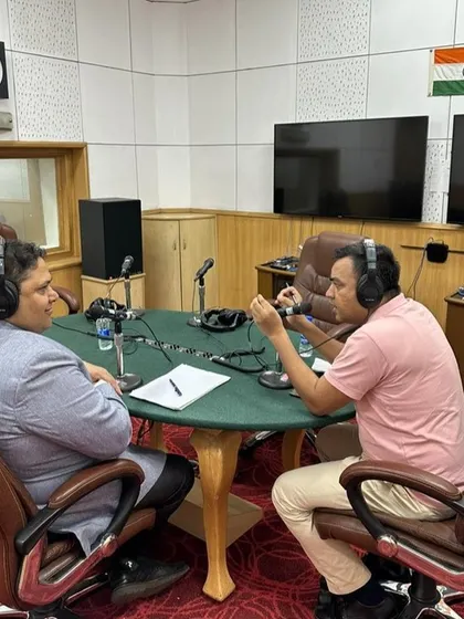 The studio environment at All India Radio is professional and focused, enabling a seamless interaction with callers. Here, we are discussing a specific consumer query during the live show.