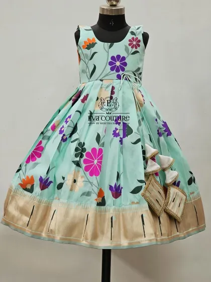Another view of the sleeveless pastel blue floral frock.