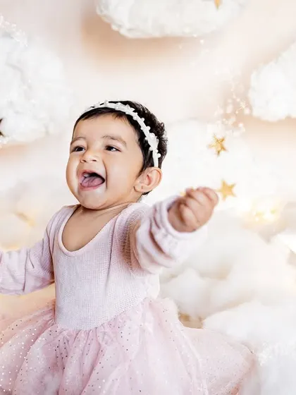 Pure joy and laughter during a "starry night" themed first birthday shoot. My goal is to capture these expressive, happy moments as your baby celebrates.