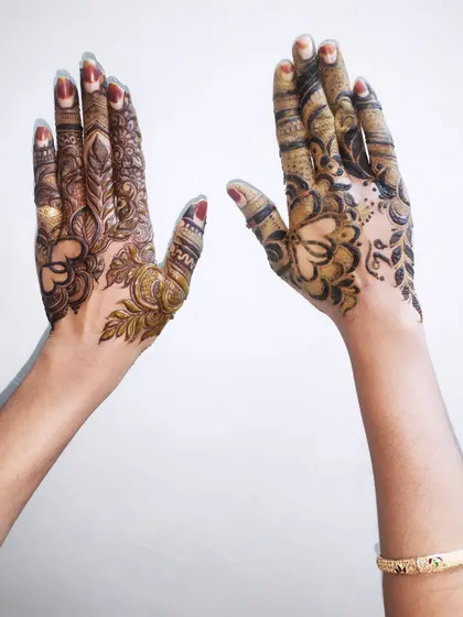 A full view of both hands, showcasing two unique styles perfect for any celebration.