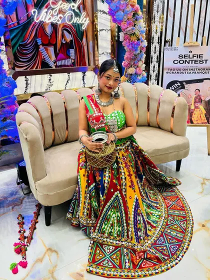 Another angle of this stunning, colorful outfit, showing the full spread of the lehenga skirt against a festive backdrop.