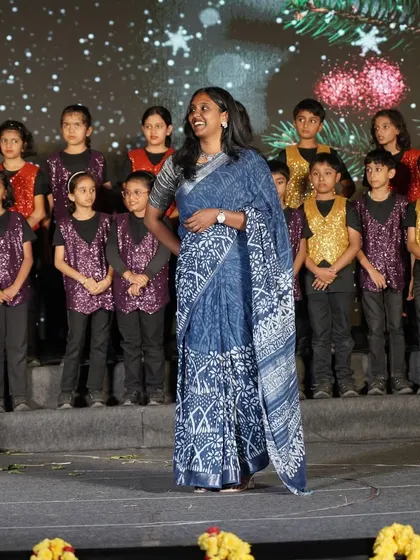 A proud moment on stage with my students. I love working with large groups and creating a cohesive, beautiful performance. This is a great example of a stage setup for a school or corporate annual day event.
