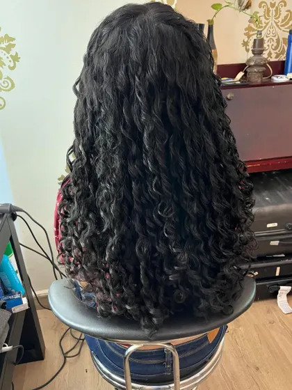 The back view of this long curly haircut, showing how to maintain length while achieving definition.