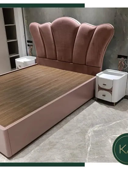 A whimsical yet elegant bed designed for a client in South City 1. The scalloped, crown-like headboard is upholstered in a soft pink velvet, creating a fairytale-like centerpiece for a dreamy bedroom retreat.