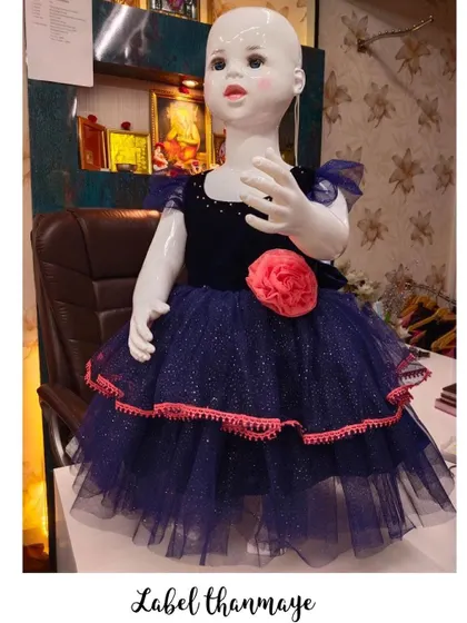 Another angle of the navy blue and pink frock, showing the glittery tulle fabric.