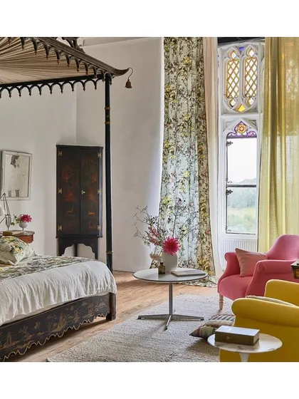 This gorgeously designed bedroom, featuring furnishings in candy-hued shades, florals, and neutrals, is an inspiration for creating a personal sanctuary. It shows how to balance colour, pattern, and calm.