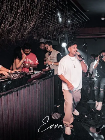 Here I am on the decks while Prince Narula performs for a packed house at EVVA. These events require seamless coordination and a deep understanding of performance flow.