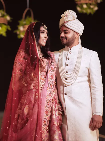 A sweet, candid moment between the newlyweds. Her makeup looks just as perfect up close.