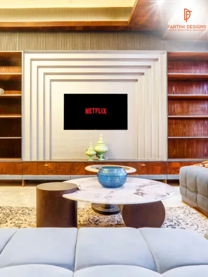 This entertainment unit is more than just a place for the TV; it's an architectural feature. The layered design and built-in shelving create a focal point in the room, blending storage and style perfectly.
