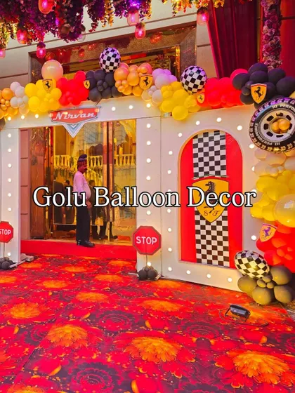 The complete entrance setup for the Ferrari-themed party, with a red carpet feel and custom archway.