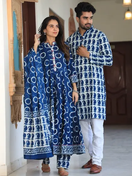 A bold indigo and white couple combo with large circular and paisley motifs. The woman's Anarkali comes with a full 2.5-meter pure cotton dupatta.