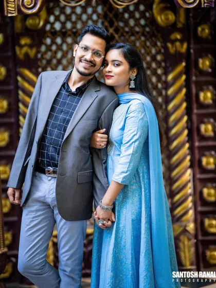 A sweet and stylish portrait of a couple in a beautiful architectural setting.